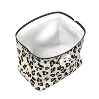 Leopard print storage bin with a white interior on a white background