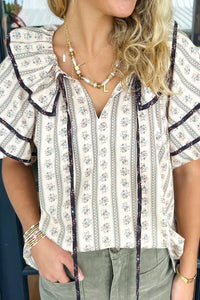 Take A Stroll Ruffled Top by Entro