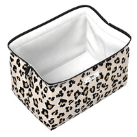 A rectangular zippered storage bin with a beige leopard print exterior and a white interior, shown on a plain white background.
