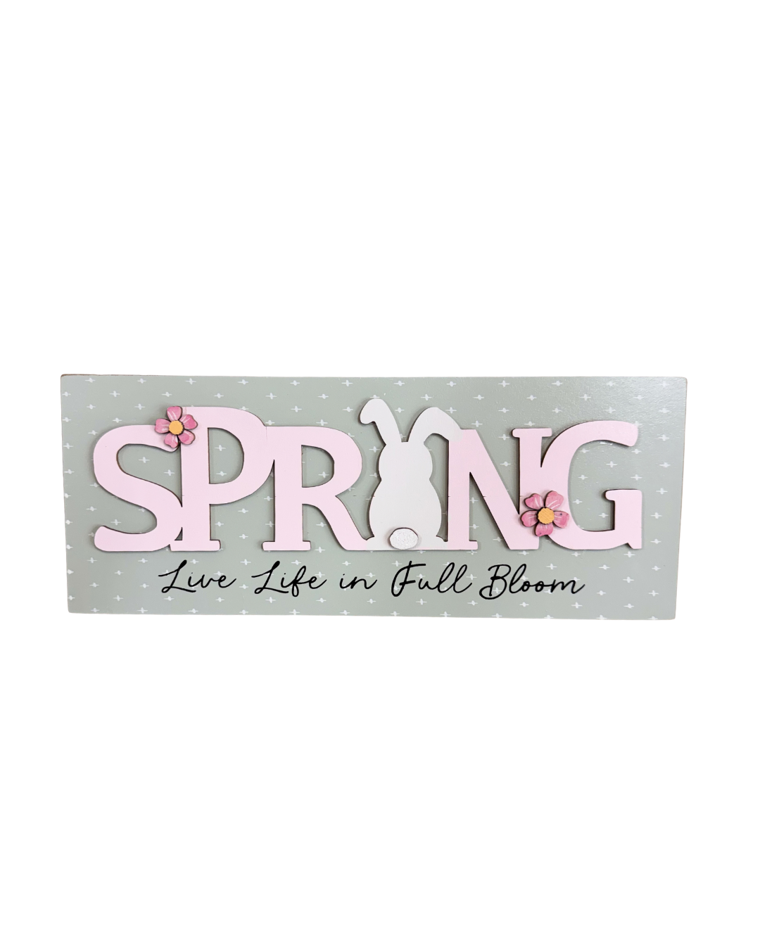 Decorative sign with 'Spring' text and floral elements on a light background